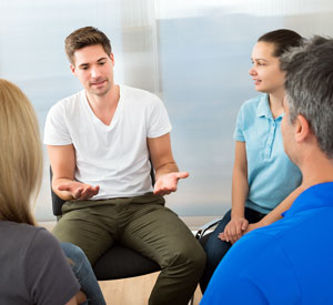 Intensive Outpatient Program Ventura CA - Image of a IOP participant speaking during group therapy.